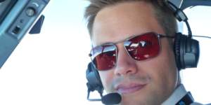 Commercial pilot wearing Bigatmo Iono photochromic sunglasses with ANR headset