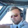 pilot on flightdeck wearing Bigatmo sunglasses